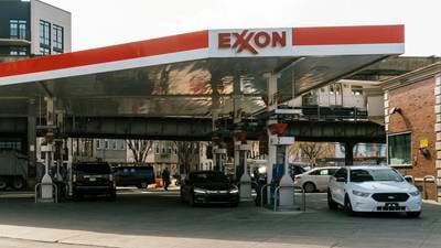 Exxon and Chevron profits slide from record highs