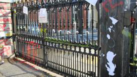 Catholic priest throws red paint at the Russian embassy in Dublin