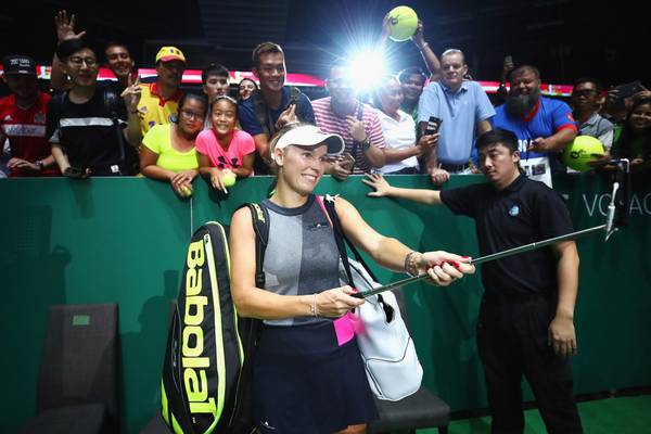 In-form Wozniacki reaches WTA semi-finals in Singapore