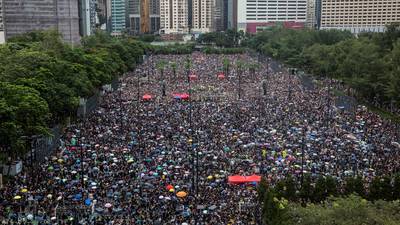 Hong Kong group behind pro-democracy protests disbands amid police pressure