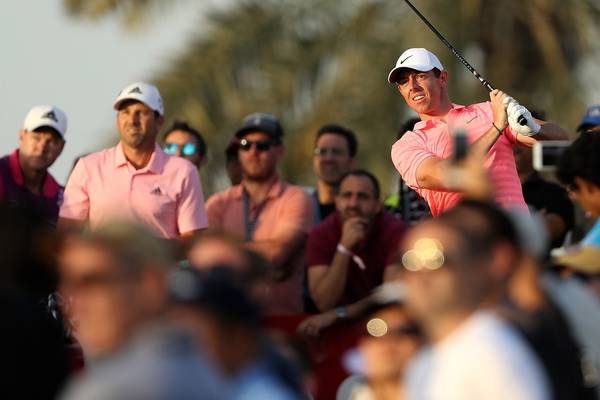 Rory McIlroy closing in on lead in Dubai as play suspended
