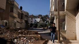 ‘This is not a normal way to live’: The Palestinian town split in two by Israel
