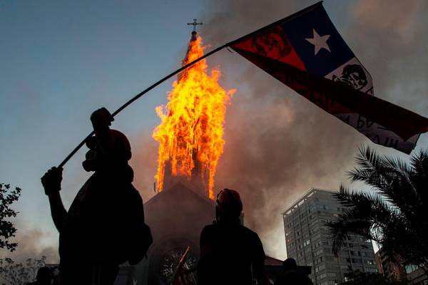 Riots, looting and churches burned as Chile anniversary rallies turn violent