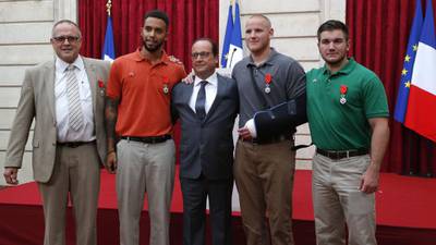 President of France honours men who overpowered gunman on train