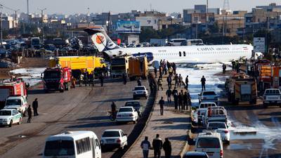 Passenger plane skids off runway and into street in Iran