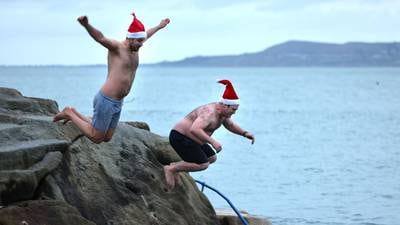 ‘A lot warmer than last year’: Swimmers take the Christmas Day plunge in Dublin Bay