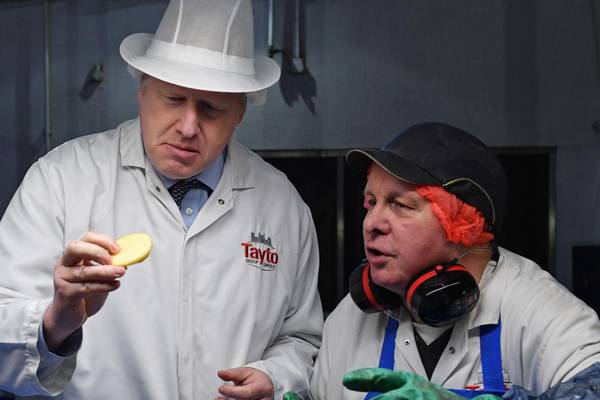 Cheese and union: Johnson defends Brexit deal in NI Tayto factory