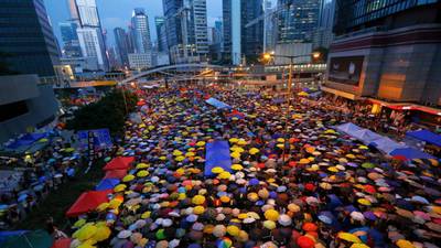 Hong Kong tries to redefine its role after democracy protests