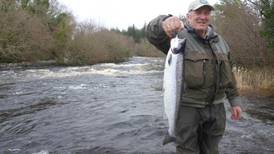 Former fisheries’ officer Jerry Looney (80) takes first wild Atlantic salmon of the year at  Killarney Lakes