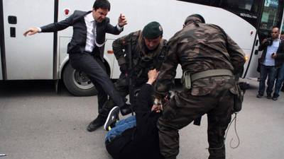 Turkish aide takes sick leave with foot injury after kicking protester