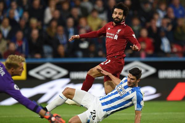 Liverpool back to winning ways as Salah sinks Huddersfield