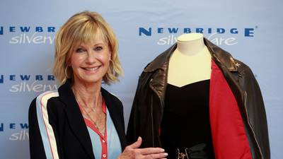 ‘I had to be stitched in’: Olivia Newton-John to sell her skin-tight Grease outfit