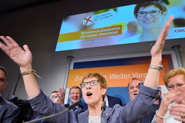 Merkel’s conservatives win regional  vote in boost for national campaign