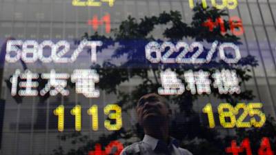 Asian shares stay near highs, dollar hobbled by Fed