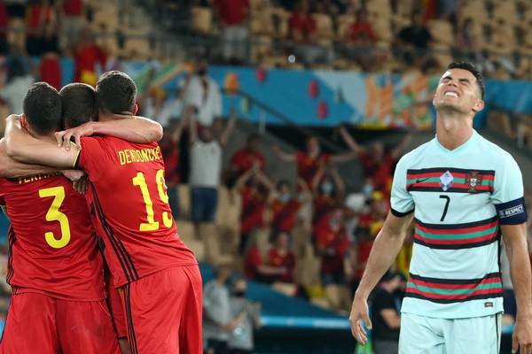 Belgium hold on to send defending champions Portugal packing