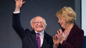 May congratulates Higgins on victory