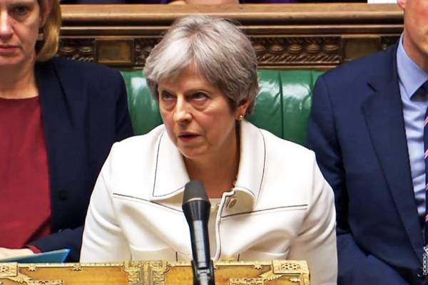 Defiant Theresa May survives Commons grilling on Syria