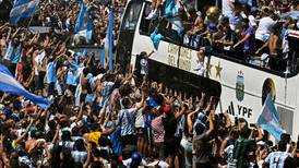 Argentina forced to swap bus for helicopters as fans swarm streets during parade