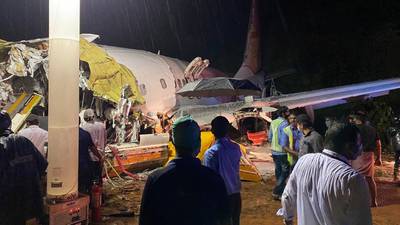 At least 16 dead after Air India plane breaks in two in Kerala