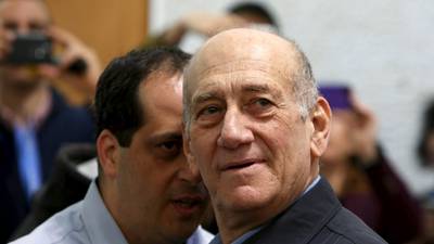 Former Israeli PM Olmert’s jail term cut, cleared of main charge