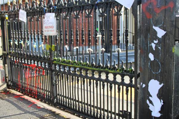 Catholic priest throws red paint at the Russian embassy in Dublin