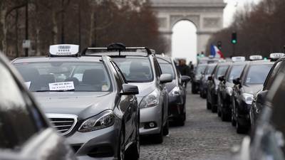 French taxi driver row with Uber service accelerates