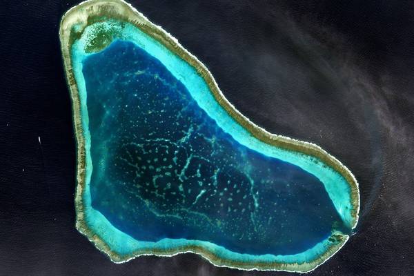 Beijing warns US away from disputed reefs in South China Sea