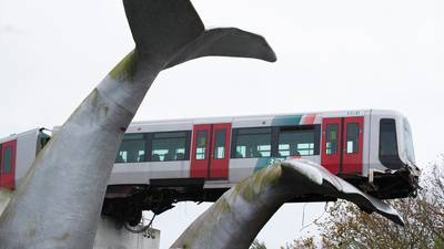 Whale sculpture saves train that ran off elevated railway