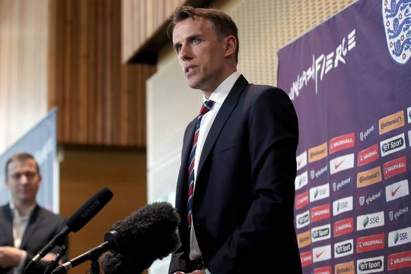 Phil Neville trips in first grilling as England women’s manager