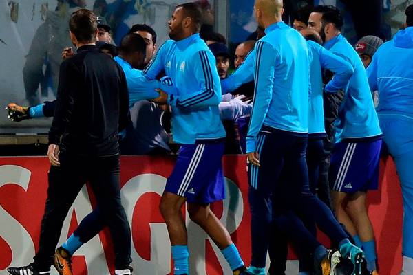 Uefa to investigate Patrice Evra after kick to head of Marseille fan