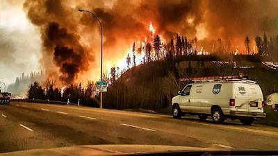 Unpredictable blaze keeps Canadian firefighters at bay