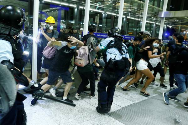 Chaotic scenes at Hong Kong airport as protesters clash with police