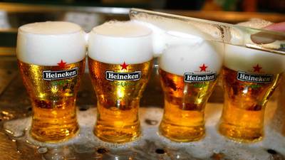 Brewer Heineken curbs profit hopes as Americas slip