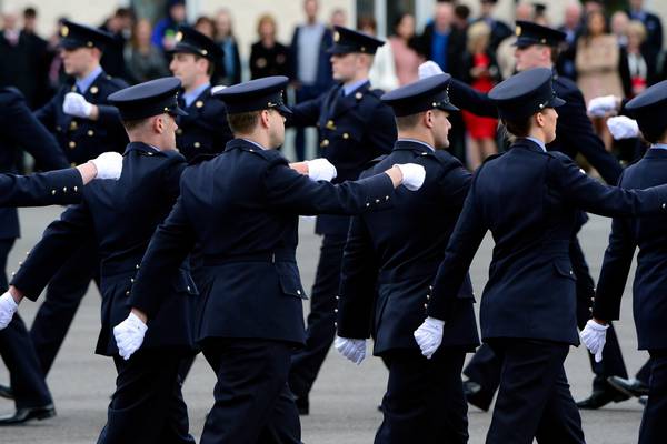 Who are the team examining the future of Irish policing?