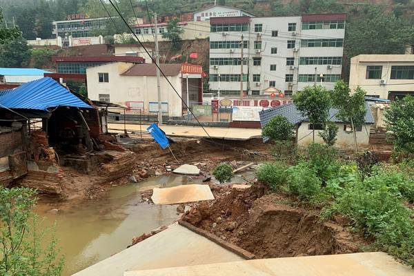 Digger trucks drafted in to rescue people stranded in China floods