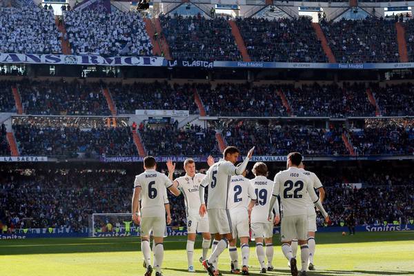 Real Madrid stroll past Granada to equal unbeaten record