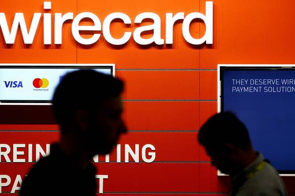 Wirecard stocks fall 14% after police raid