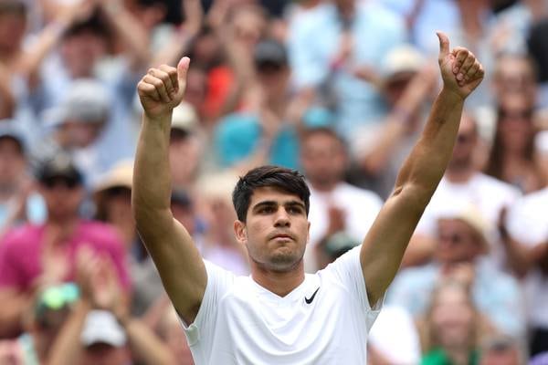Carlos Alcaraz starts Wimbledon defence with straight-sets win over Mark Lajal