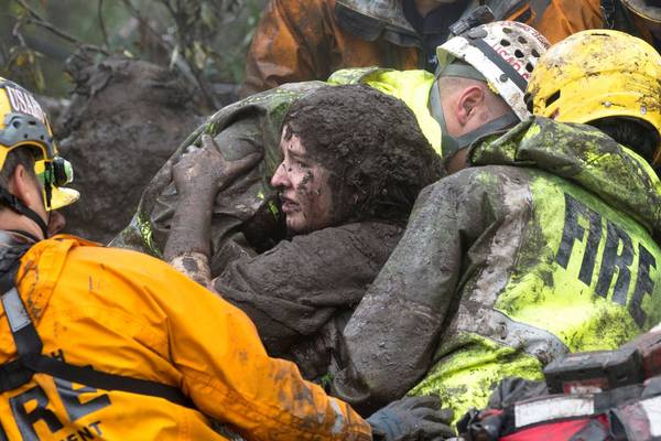 California mudslides: 17 dead and search continues for missing