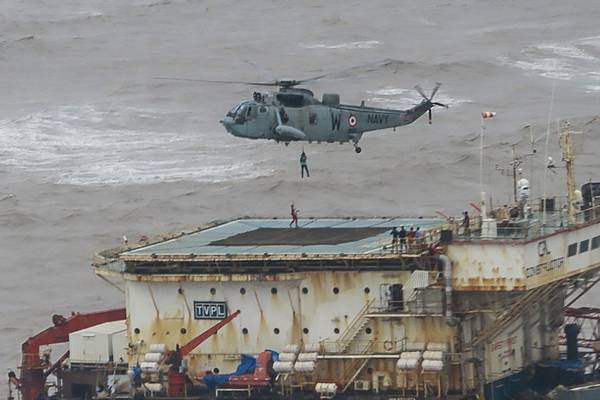 Indian navy searches for 77 missing from barge sunk by cyclone