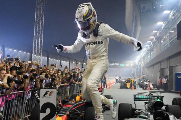 Hamilton takes full advantage of Vettel’s first-lap crash in Singapore