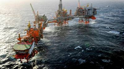 Oil giants cut back as price per barrel falls close to $30