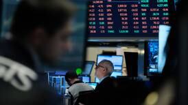 European stock markets inch down after central banks hike rates