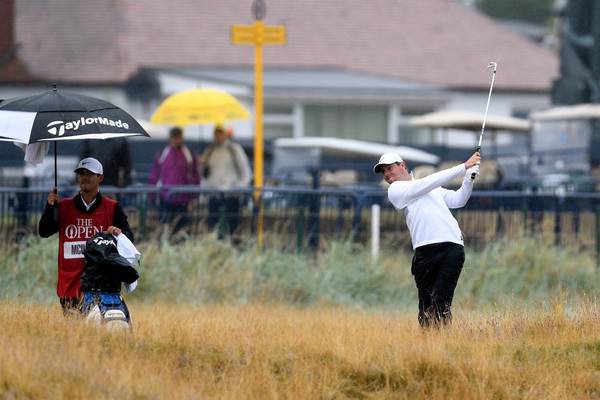 Rory McIlroy battles the rain to close on British Open lead