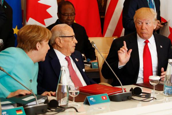 Donald Trump backs down on protectionism at G7 summit