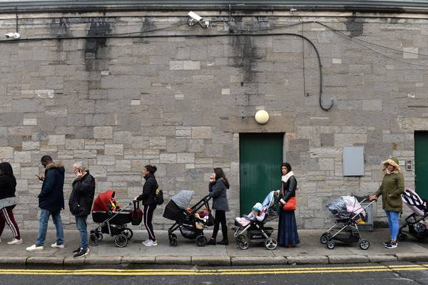 Hundreds of families queue for nappies and infant milk