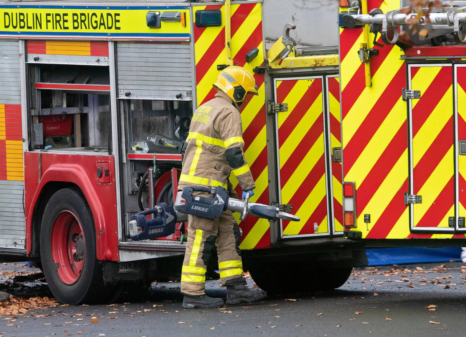 /19/11'19 The body is removed from   the scene, with the help of cutting equipment from Dublin Fire Brigade on Mount Andrew Court, Lucan this afternoon where the body of a man was discovered in a burning car last night...Picture Colin Keegan, Collins Dublin