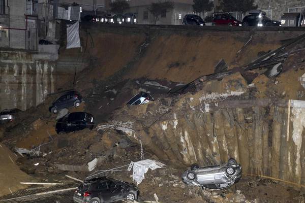 Huge sinkhole swallows cars on street in Rome