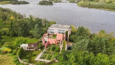 Pretty in pink: Timeless architect-designed house on 30 acres of forest by the lake for €699,550