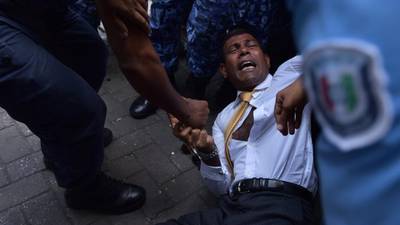 Police drag former Maldives president into court